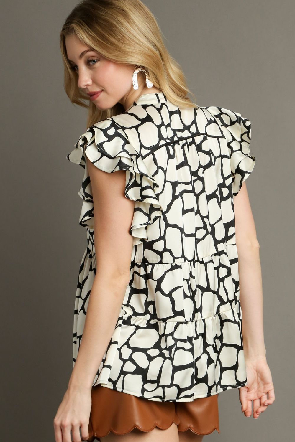 Umgee Full Size Two Tone Animal Print Notched Ruffle Cap Sleeve Blouse Plus Size-Very Besty